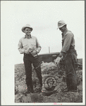 Farmer and son with sack of potatoes, Rio Grande County, Colorado