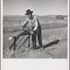 Opening gate leading from Rio Grande, conserving canal in order to irrigate field. Dona Ana County, New Mexico