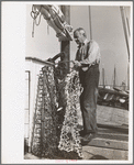 Oysterman with dredge for gathering oysters, Bivalve, New Jersey