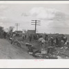 State highway officials moving sharecroppers away from roadside to area between the levee and Mississippi River, New Madrid County, Missouri