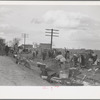 State highway officials moving sharecroppers away from roadside to area between the levee and Mississippi River, New Madrid County, Missouri