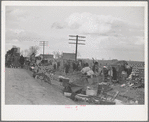 State highway officials moving sharecroppers away from roadside to area between the levee and Mississippi River, New Madrid County, Missouri