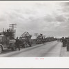 State highway officials moving sharecroppers away from roadside to area between levee and Mississippi River, New Madrid County, Missouri