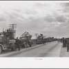 State highway officials moving sharecroppers away from roadside to area between levee and Mississippi River, New Madrid County, Missouri