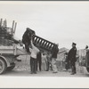 State highway officials moving evicted sharecroppers away from roadside to area between the levee and the Mississippi River, New Madrid County, Missouri