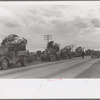 State highway officials moving evicted sharecroppers away from roadside to area between the levee and the Mississippi River, New Madrid County, Missouri