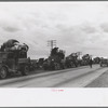 State highway officials moving evicted sharecroppers away from roadside to area between the levee and the Mississippi River, New Madrid County, Missouri