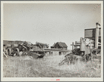 Home of wheat farmer-speculator. Cheap house and heavy investment in machinery. Box Butte County, Nebraska