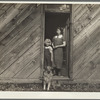 Farm wife and child who are to be removed to better farmland while present will revert to grazing land. Oneida County, Idaho