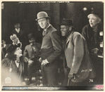 Percy Marmont and unidentified others in the motion picture The Street of Forgotten Men