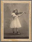 Aline MacMahon as a child, full figure in white dress playing violin with black ballet shoes