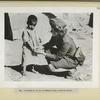 A Polish A.T.S. in Teheran with a native child.