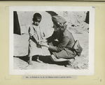 A Polish A.T.S. in Teheran with a native child.