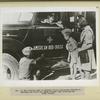 In the civilian camp in Teheran Polish boy-scouts welcome an American Red Cross car.