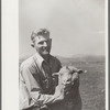 Elmo Temple, Chaffee County, Colorado rehabilitation client poses with one of his lambs