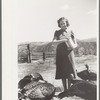 Mrs. Louise Temple feeds some of her turkeys on their farm in Chaffee County, Colorado