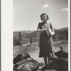 Mrs. Louise Temple feeds some of her turkeys on their farm in Chaffee County, Colorado
