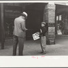 Newsboy on main street, Montrose, Colorado