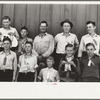 4-H Club boys, all sons of resettlement families on Western Slope Farms, Colorado, pose with their leader (top row, third from left)