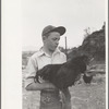 Wayne Beede, son of resettlement client, Western Slope Farms, Colorado, exhibits a champion rooster
