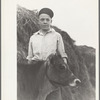 Wayne Beede, son of resettlement client, Western Slope Farms, Colorado, poses with his prizewinning 4-H calf