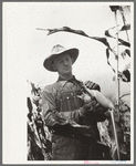 Thomas W. Beede exhibits some of the corn grown on his farm, Western Slope Farms, Colorado