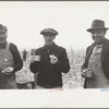 Farmers at cornhusking contest, Marshall County, Iowa