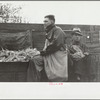 Gleaners of wagon load being taken to scales, cornhusking contest, Marshall County, Iowa