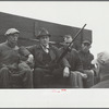 County agent with starting gun, cornhusking contest, Marshall County, Iowa