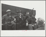 County agent with starting gun, cornhusking contest, Marshall County, Iowa