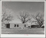 New adobe house. Temporary house in background. Bosque Farms, New Mexico