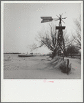 Windmill and tank on an abandoned farm. Cimarron County, Oklahoma