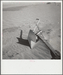 Plow covered by sand. Cimarron County, Oklahoma