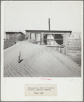 Sand piled up in front of outhouse on farm. Cimarron County, Oklahoma