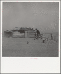 Farmer and sons walking in the face of a dust storm. Cimarron County, Oklahoma