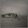Farmer and sons walking in the face of a dust storm. Cimarron County, Oklahoma