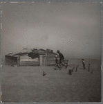 Farmer and sons walking in the face of a dust storm. Cimarron County, Oklahoma