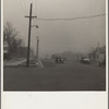 Autos have to turn on lights to penetrate gloom of dust storm. Amarillo, Texas