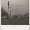Autos have to turn on lights to penetrate gloom of dust storm. Amarillo, Texas