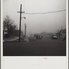 Autos have to turn on lights to penetrate gloom of dust storm. Amarillo, Texas