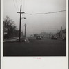 Autos have to turn on lights to penetrate gloom of dust storm. Amarillo, Texas