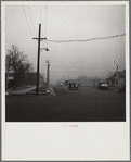 Autos have to turn on lights to penetrate gloom of dust storm. Amarillo, Texas