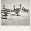 Dust covering farm implements. Castro County, Texas