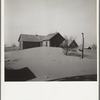 Dust piled up around farmhouse. [Cimarron County?,] Oklahoma