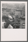 José Limón in front of in front of reliefs, likely Quetzalcoatl at ruins of Teotihuacan