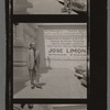 José Limón in front of poster for his company in Argentina