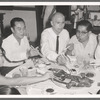 José Limón dining with unknown dinner companions on Asia trip