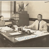 A. Philip Randolph of the Brotherhood of Sleeping Car Porters, seated in his office, with his administrative assistant at typewriter