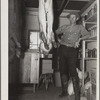 C.D. Grant in storehouse on his farm at Penderlea Homesteads. North Carolina