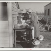 Mrs. C.D. Grant and neighbor making pork sausage. Penderlea Farms, North Carolina